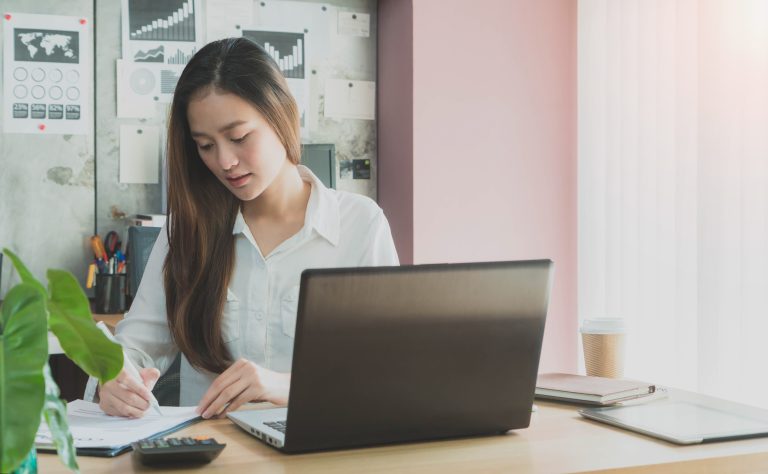 beautiful young asian girl working home office with laptop 11zon